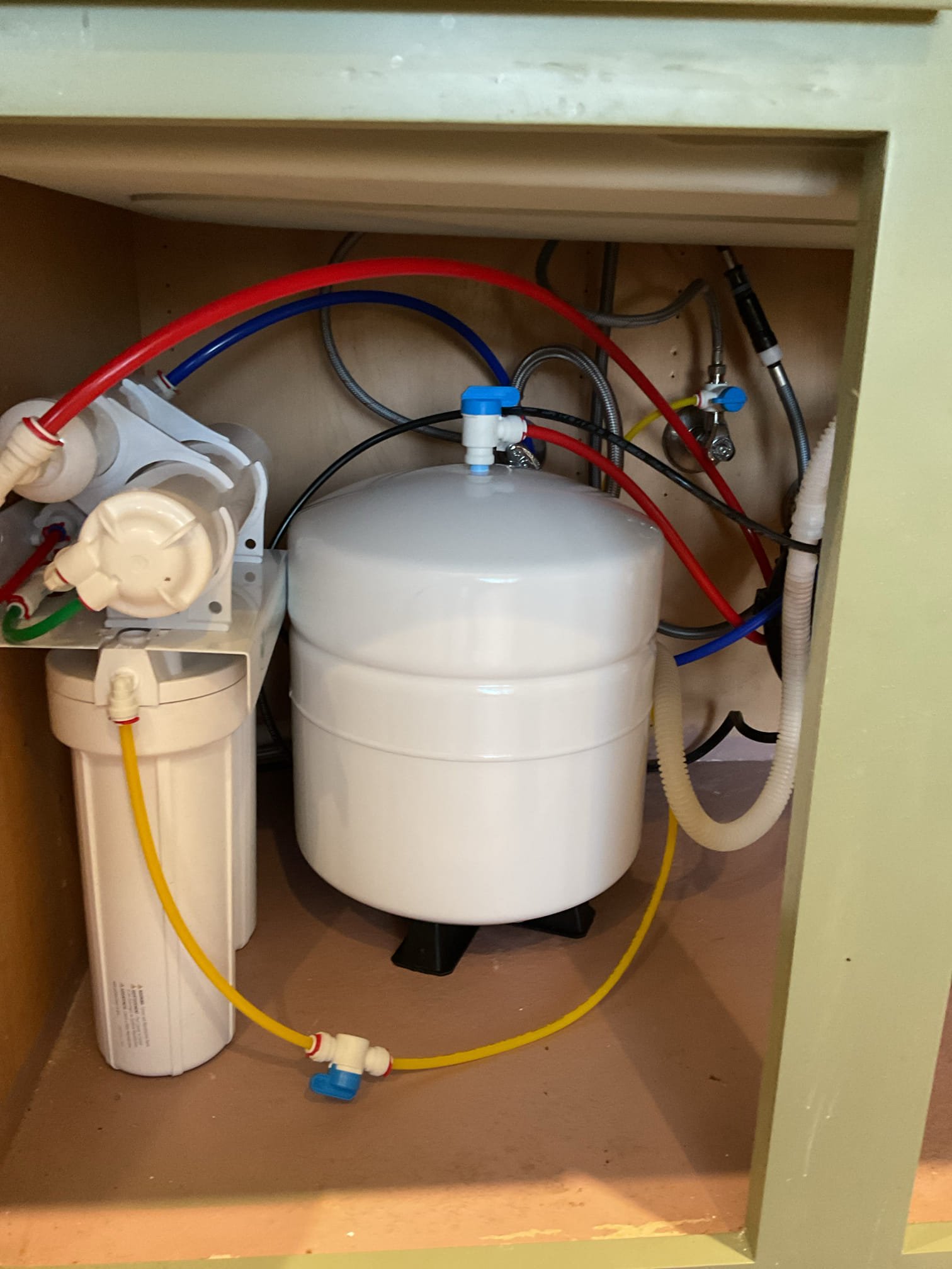 Small water treatment system under the kitchen sink