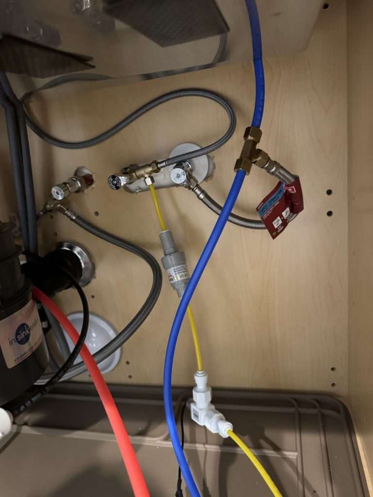 PEX blue and red water lines after a pipe replacement service.