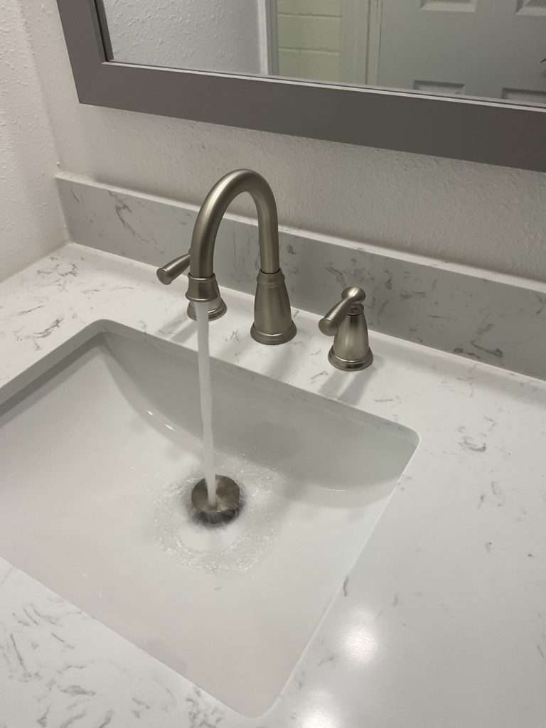 Recently installed modern sink and faucet.