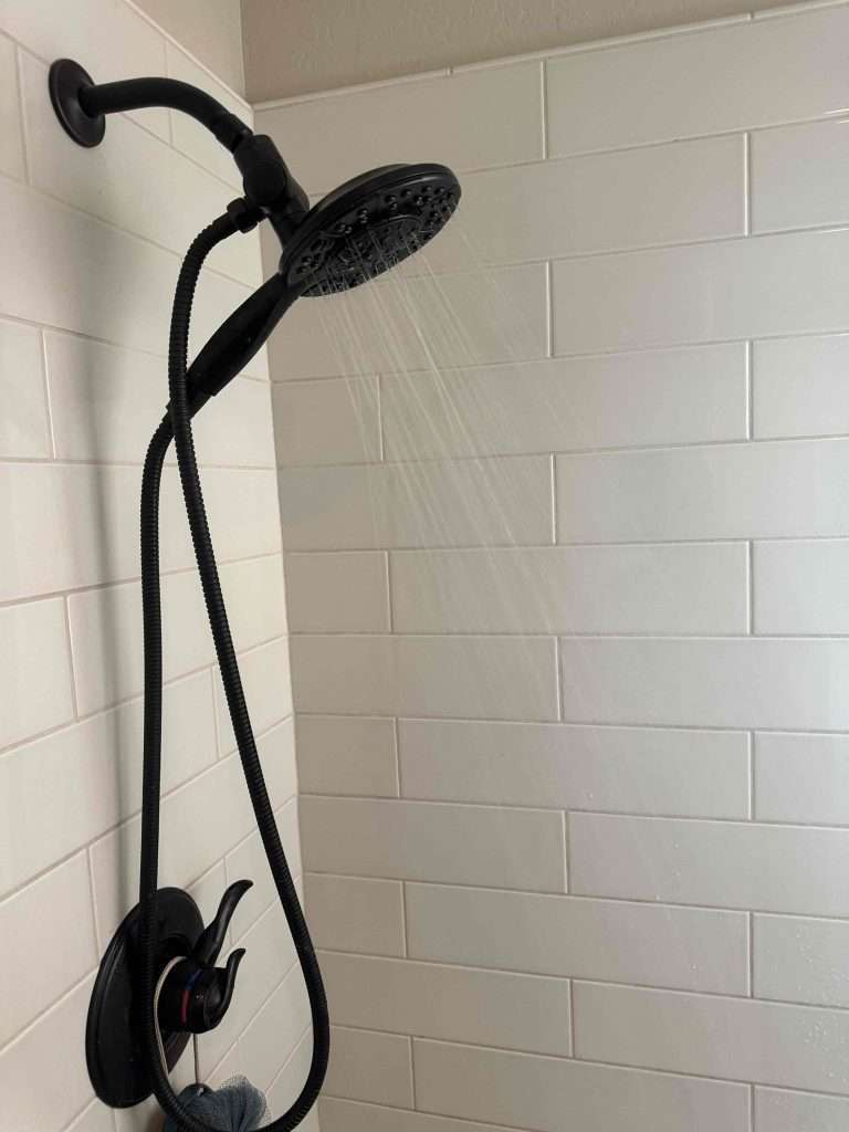 Black shower after plumbing repairs.
